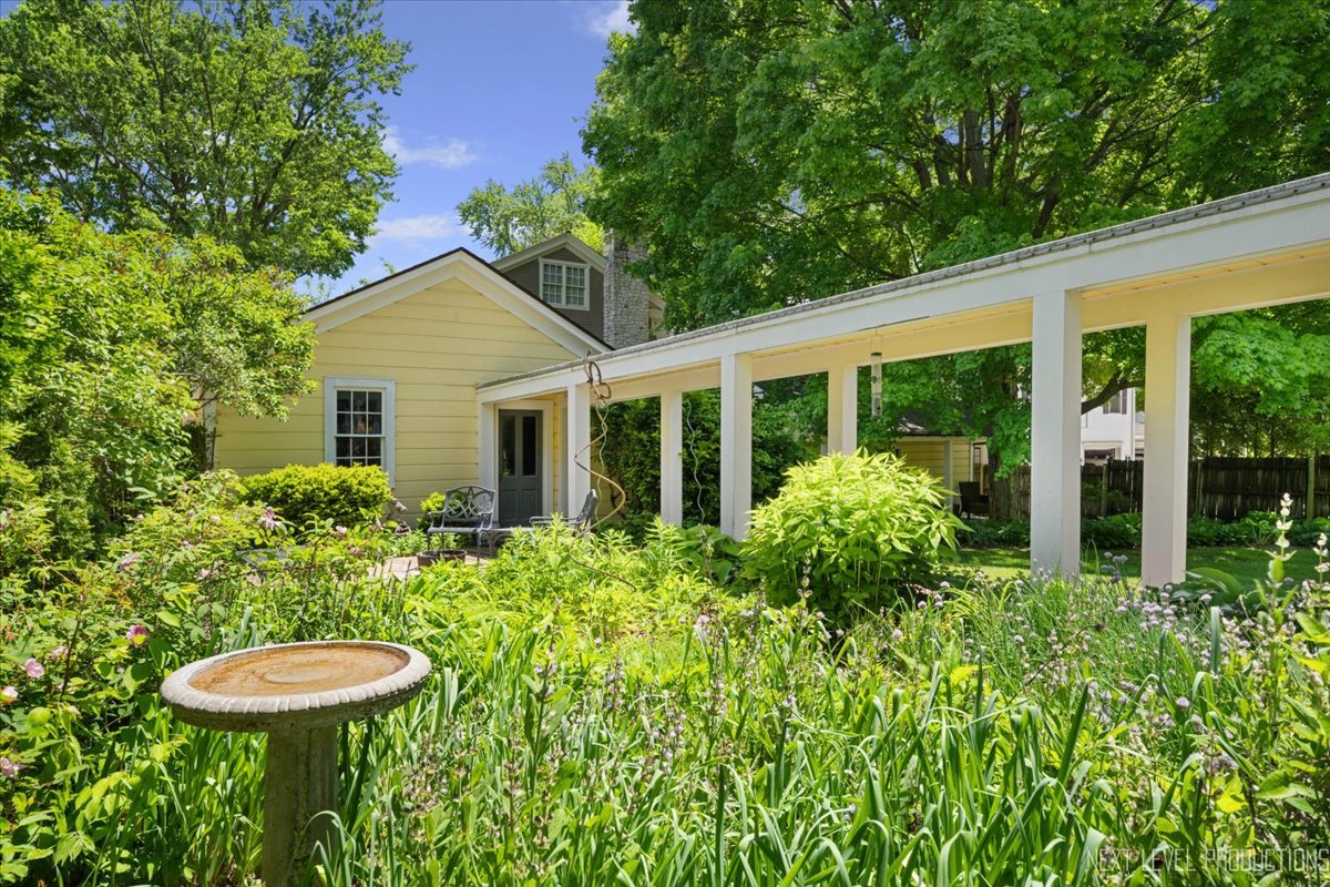 301 South 1st Street Geneva, IL 60134 - Photo 21 of 25 a view of a house with a backyard and porch