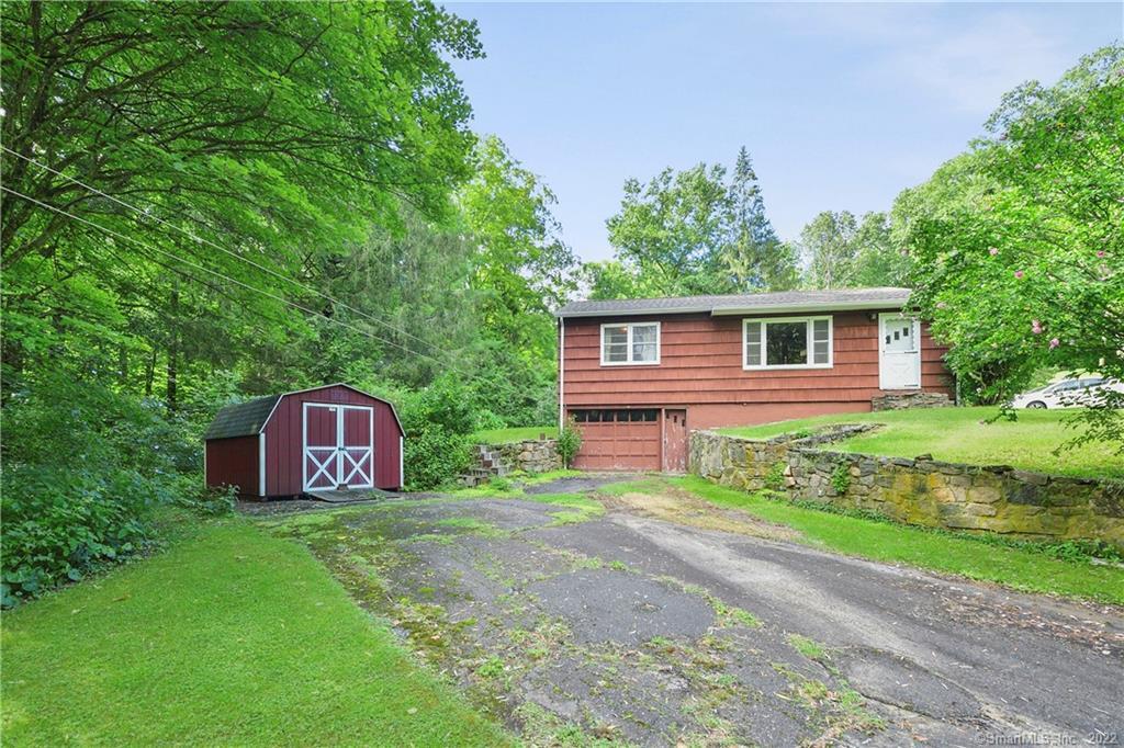 23 Connelly Road New Milford, CT 06776 - Photo 1 of 1 a house view with a garden space