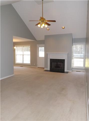 124 Foxrun Springfield, TN 37172 - Photo 14 of 20 Vaulted ceiling, ceiling fan, and gas fireplace in greatroom.