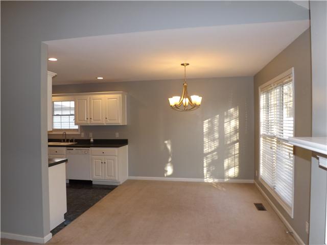 124 Foxrun Springfield, TN 37172 - Photo 18 of 20 Dining room open to greatroom and kitchen, overlooks back yard with double windows.