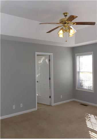 124 Foxrun Springfield, TN 37172 - Photo 10 of 20 Large main bedroom with trey ceiling, and ceiling fan.