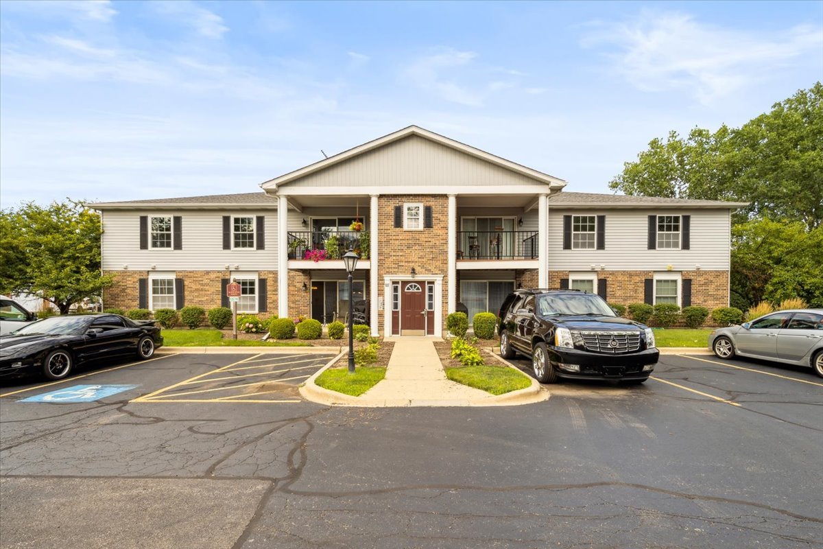 935 Golf Course Road, Unit 1 Crystal Lake, IL 60014 - Photo 1 of 10 a view of a car parked in front of a house