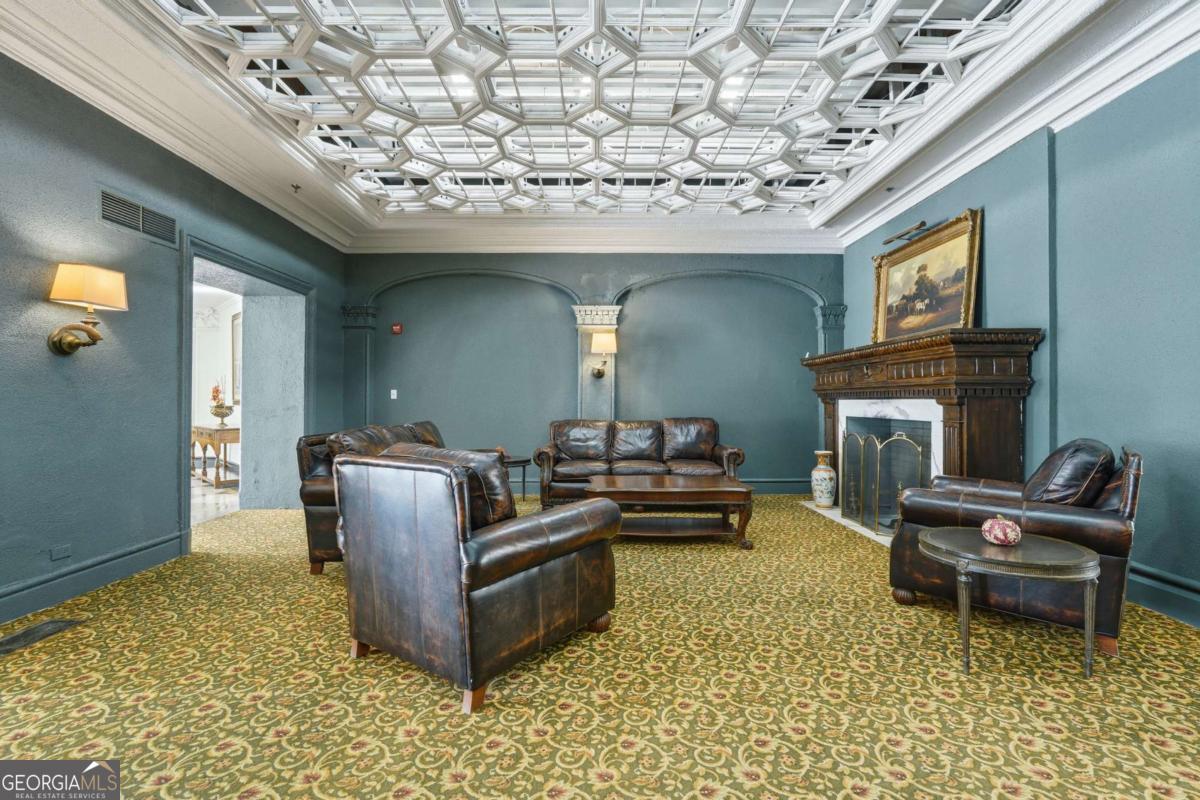 700 Wilmington Island Road, Unit 201 Savannah, GA 31410 - Photo 11 of 51 a living room with furniture and a fireplace