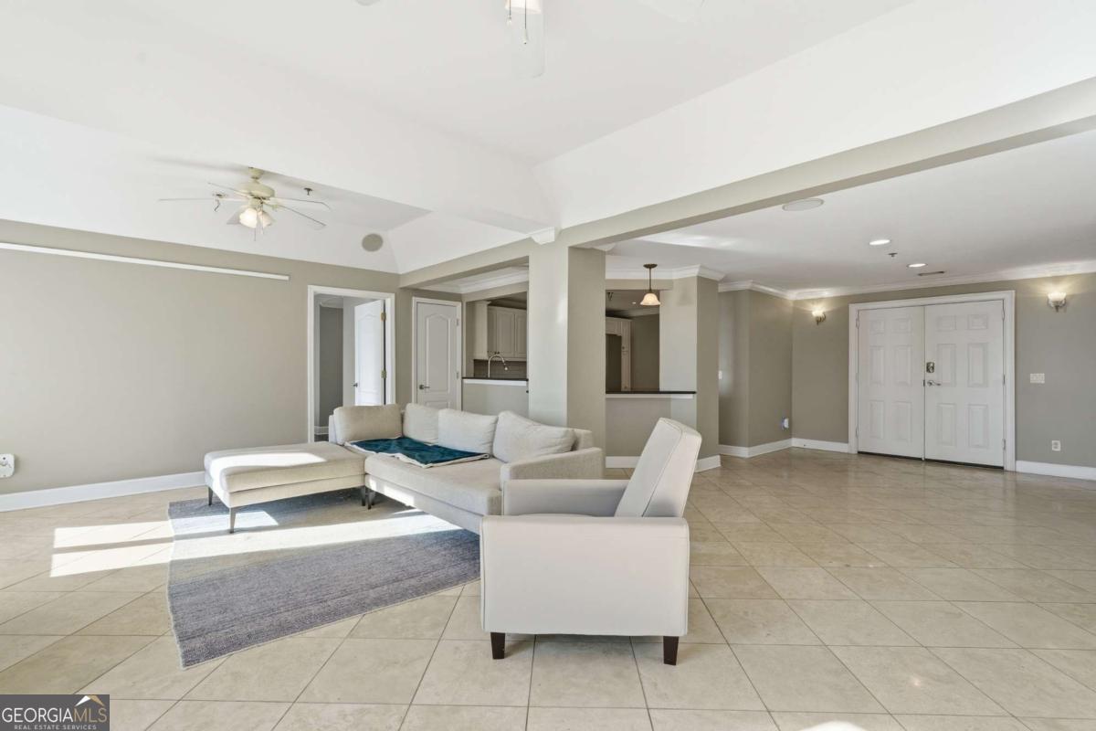 700 Wilmington Island Road, Unit 201 Savannah, GA 31410 - Photo 15 of 51 a living room with furniture and a table