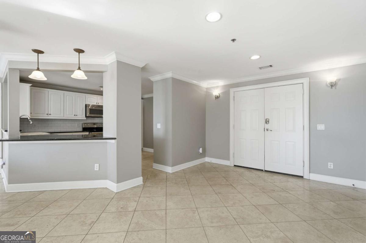 700 Wilmington Island Road, Unit 201 Savannah, GA 31410 - Photo 25 of 51 a view of a kitchen with an empty space