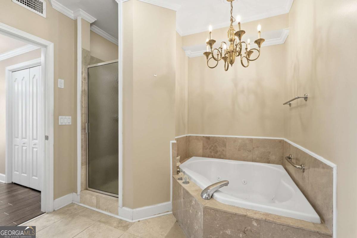 700 Wilmington Island Road, Unit 201 Savannah, GA 31410 - Photo 38 of 51 a bathroom with a tub