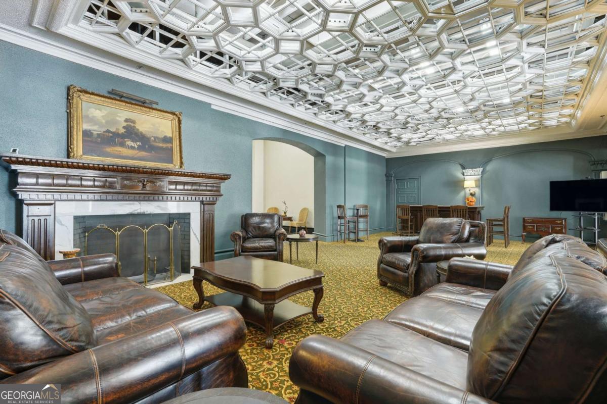 700 Wilmington Island Road, Unit 201 Savannah, GA 31410 - Photo 6 of 51 a living room with furniture and a fireplace