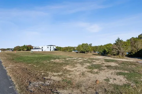 a view of a field with houses