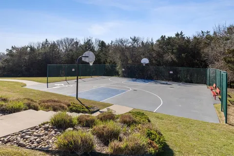 a view of a lake with houses in the back