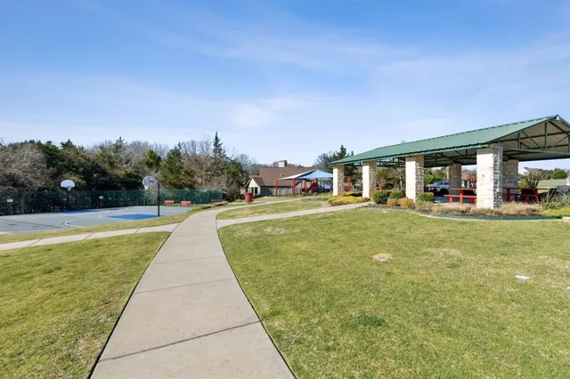 a view of a backyard of the house