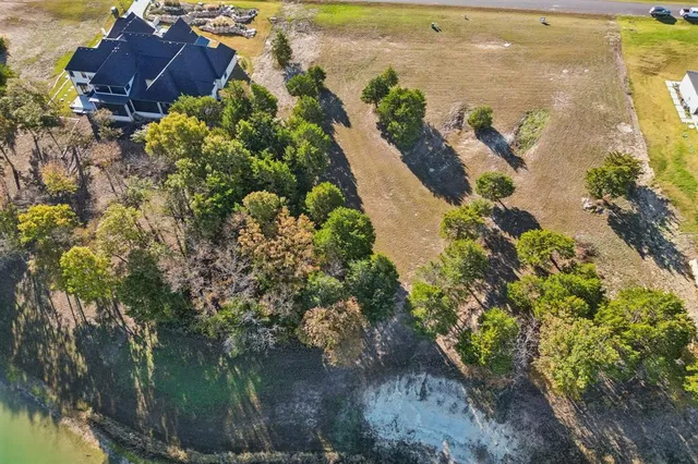 a view of a field with an trees