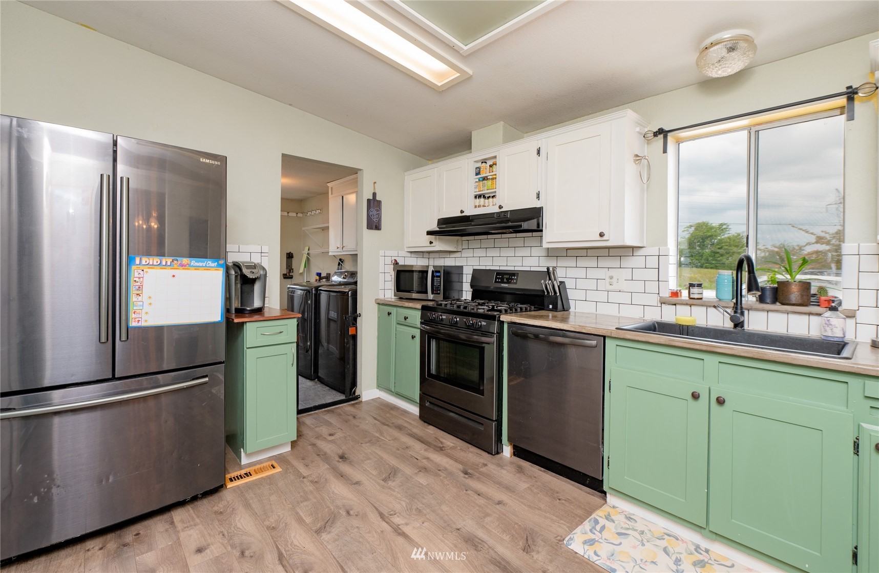 2799 Fox Road Ferndale, WA 98248 - Photo 14 of 25 a kitchen with a refrigerator stove and sink