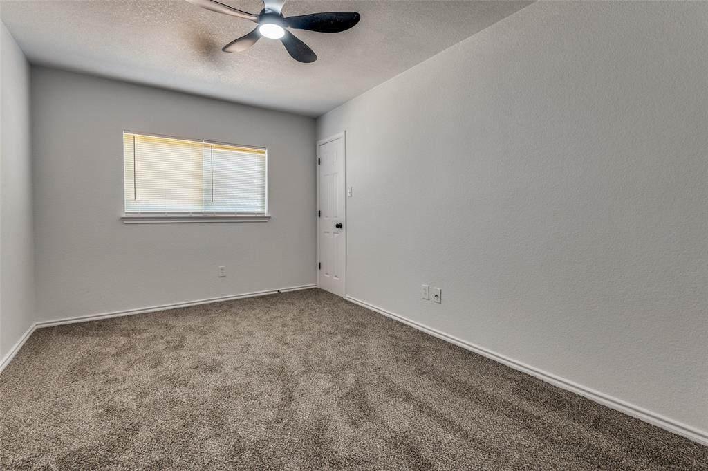 6524 Willow Oak Court Fort Worth, TX 76112 - Photo 14 of 15 wooden floor in an empty room with a window