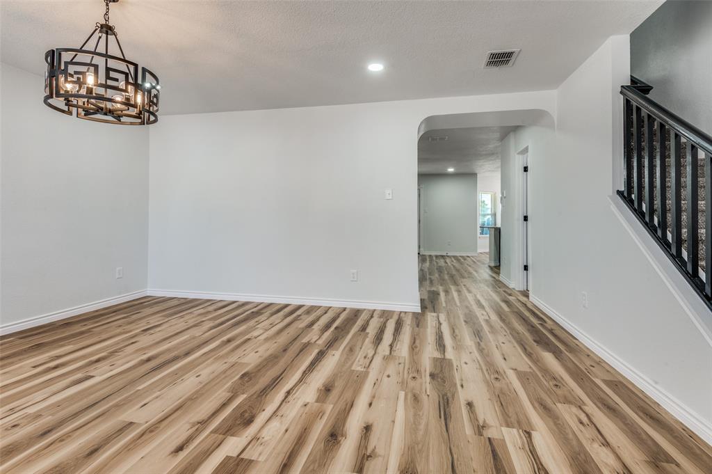 6524 Willow Oak Court Fort Worth, TX 76112 - Photo 3 of 15 a view of a room with wooden floor and staircase