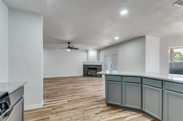 a view of a kitchen with microwave and cabinets
