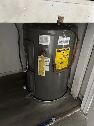 a view of storage and utility room with wooden floor