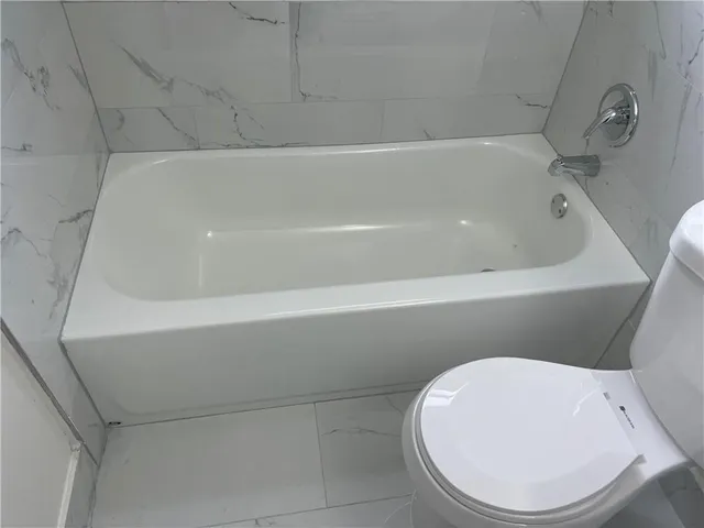 a view of swimming pool with a sink and wooden floor