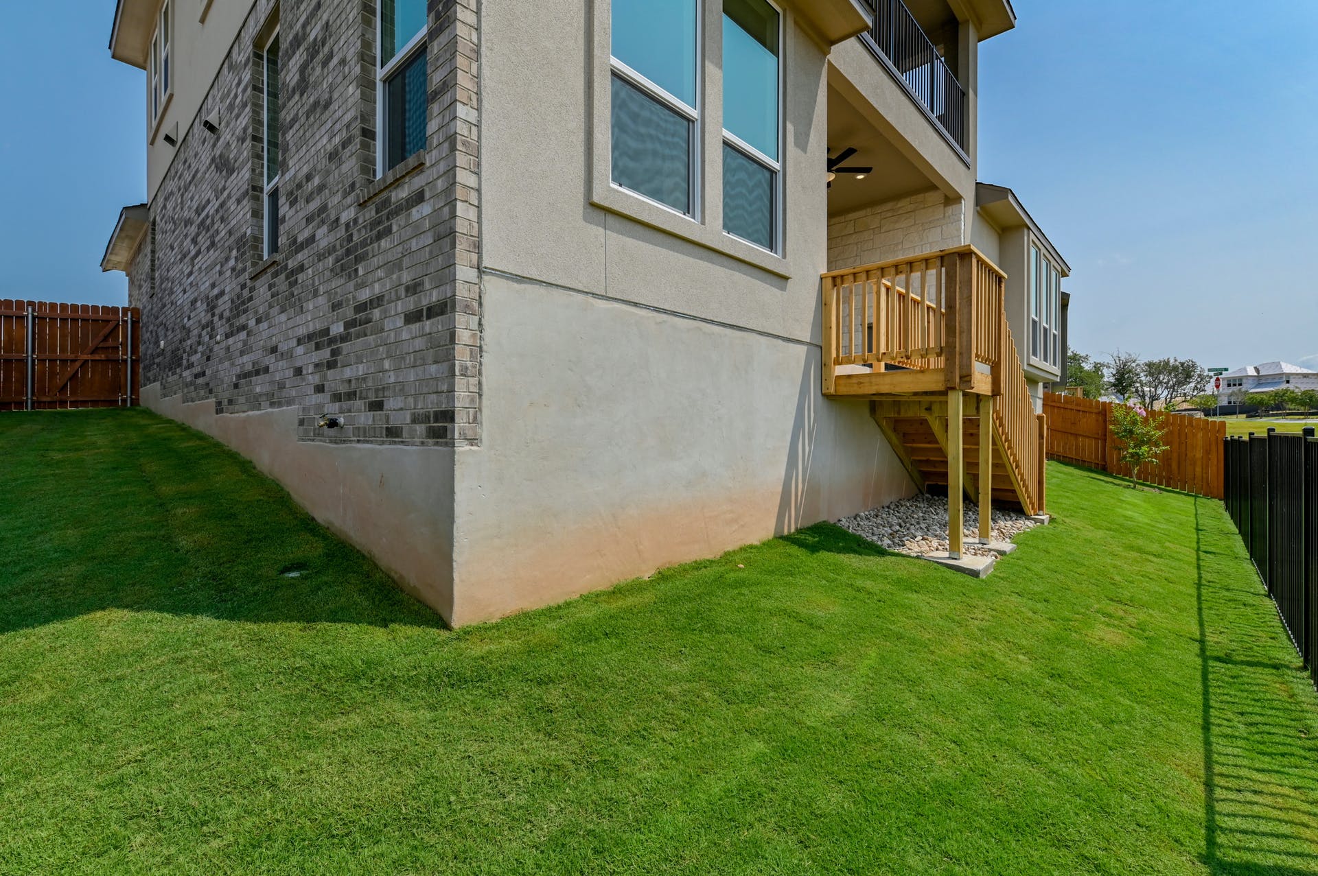19005 Fernando Trail Austin, TX 78738 - Photo 31 of 35 View of side of home with a fenced backyard and stucco siding