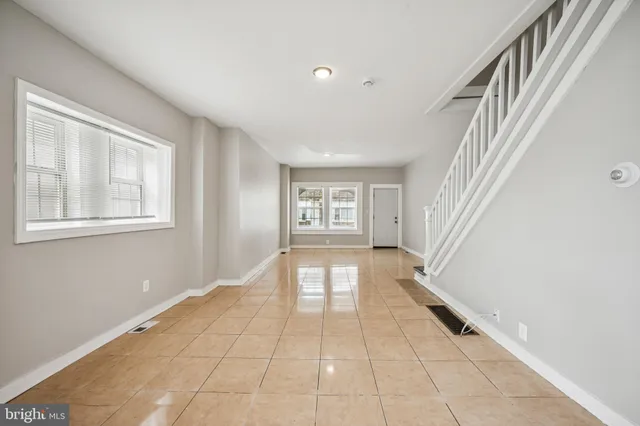 a view of an entryway with wooden floor