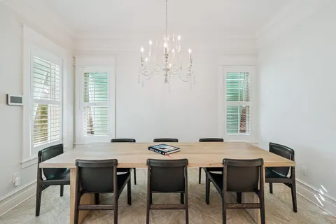 a view of a dining room with furniture window and outside view