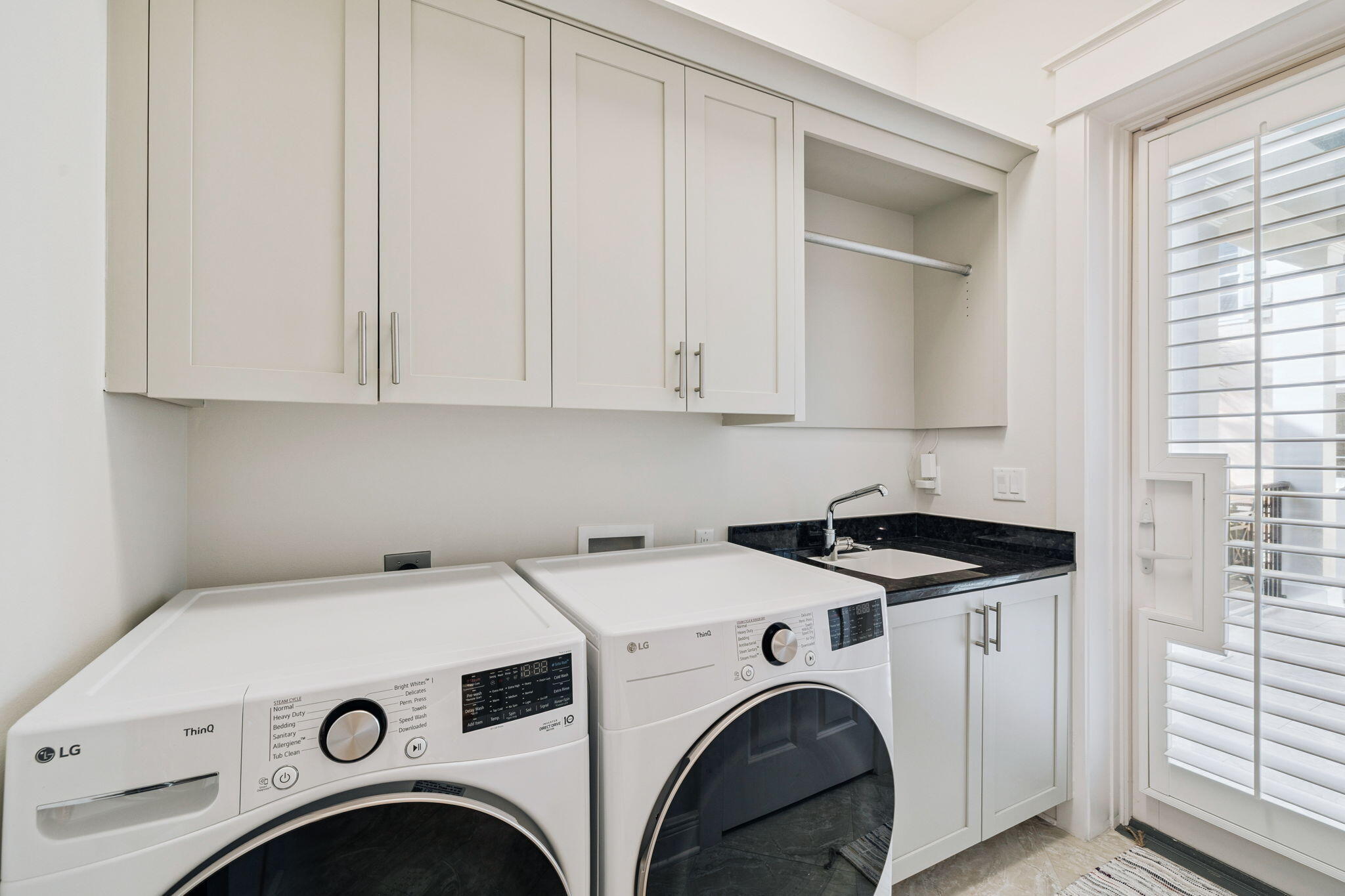 358 Rue Caribe Miramar Beach, FL 32550 - Photo 19 of 65 a utility room with dryer and washer