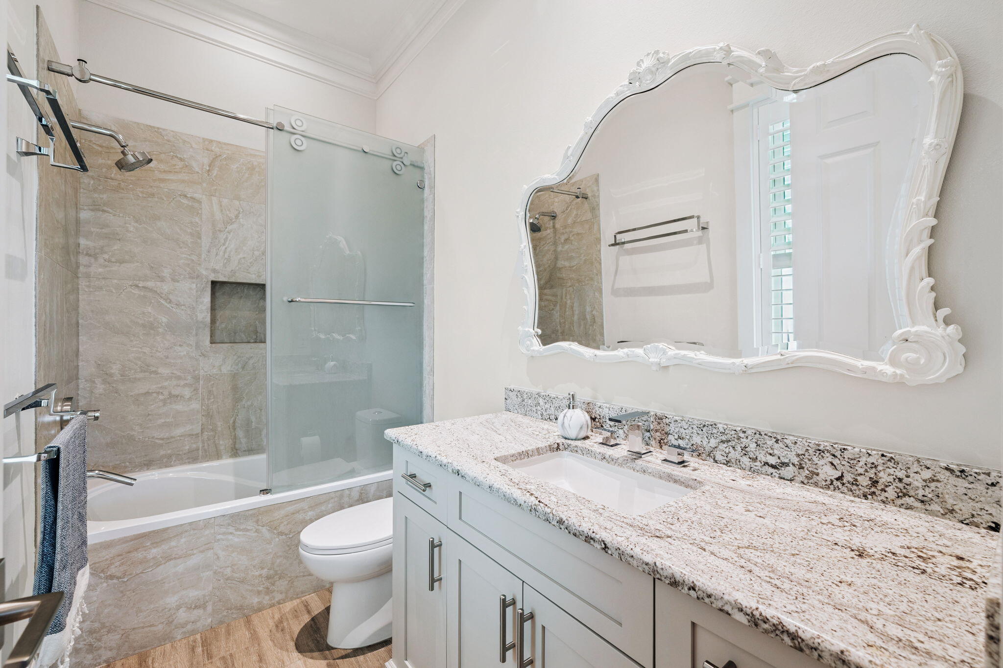 358 Rue Caribe Miramar Beach, FL 32550 - Photo 35 of 65 a bathroom with a granite countertop sink toilet mirror and shower