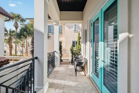 a view of a balcony with wooden floor