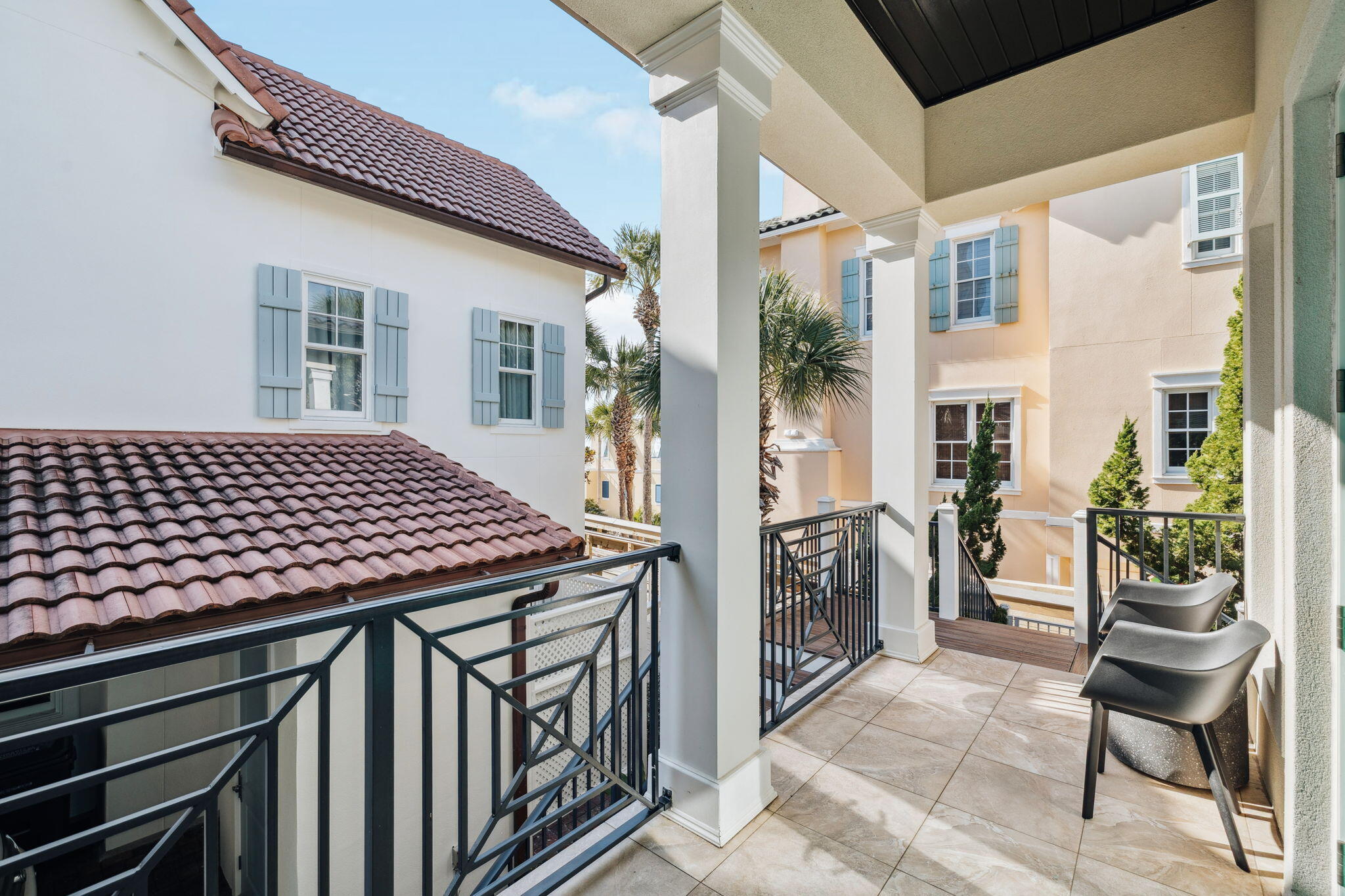 358 Rue Caribe Miramar Beach, FL 32550 - Photo 45 of 65 a view of a patio with table and chairs and potted plants
