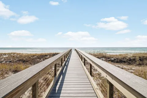a front view of a residential apartment building with a yard