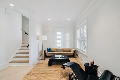 a bedroom with furniture and a window