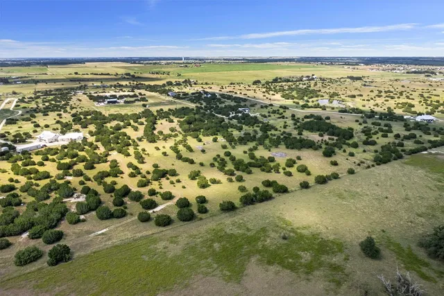 a view of a large body of water with a building in the background