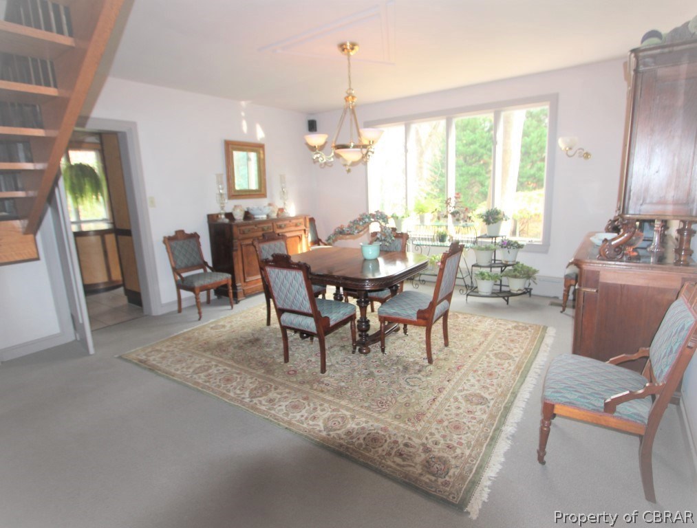 7205 Ware House Road Gloucester, VA 23061 - Photo 11 of 32 Dining Room with view to the amazing landscaping