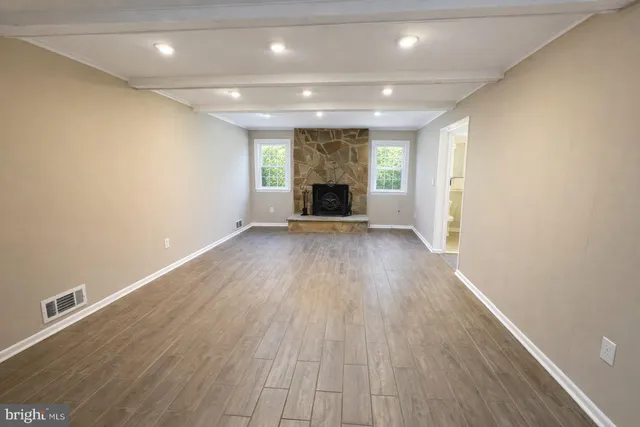 a bathroom with a toilet sink and window