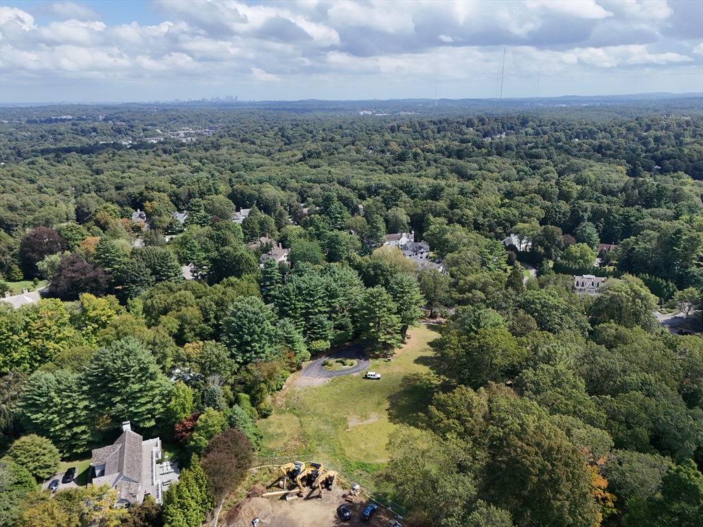 an aerial view of a houses with a yard
