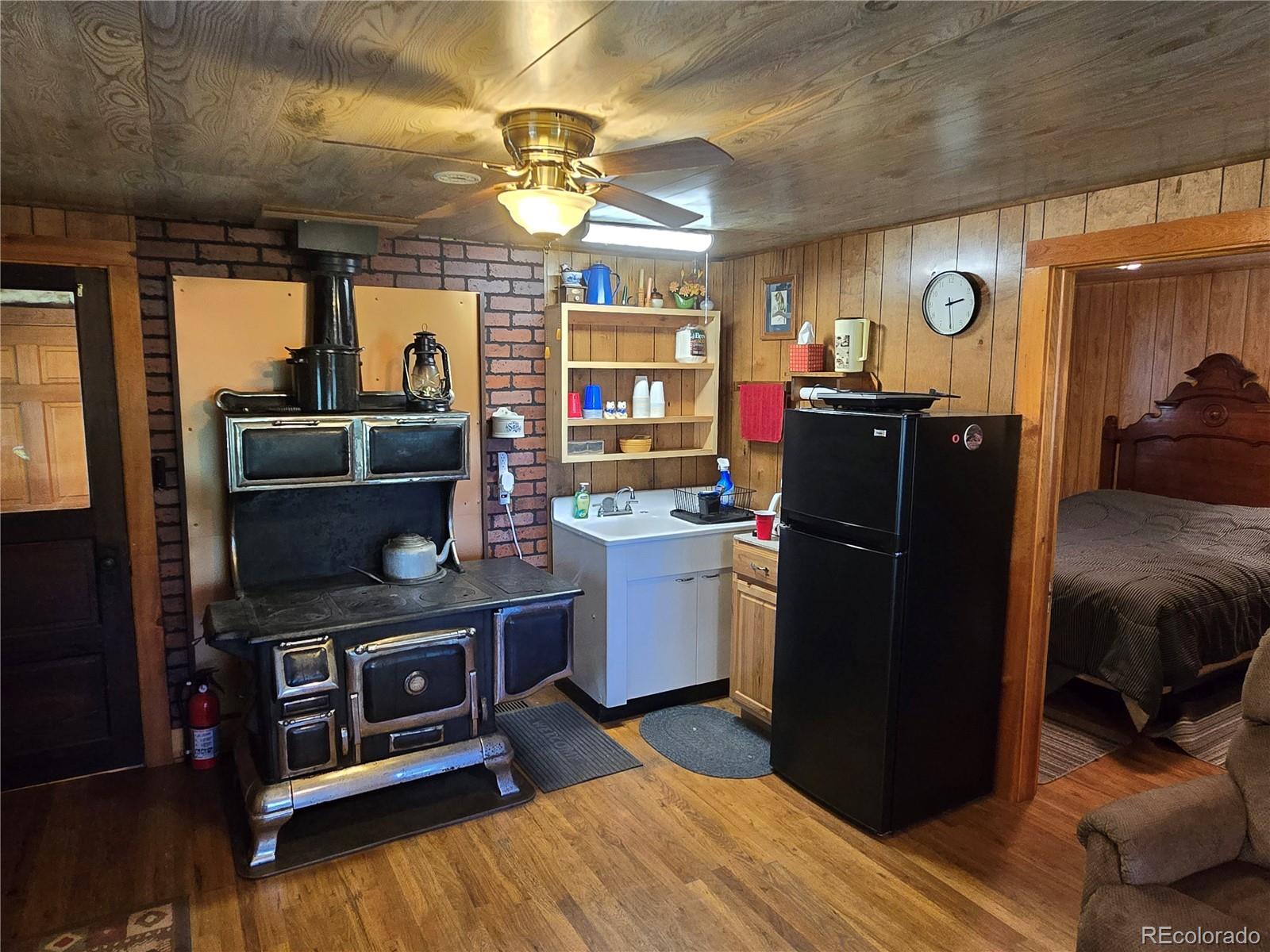 9626 Highway 165 Rye, CO 81069 - Photo 9 of 27 a kitchen with a refrigerator and a stove top oven