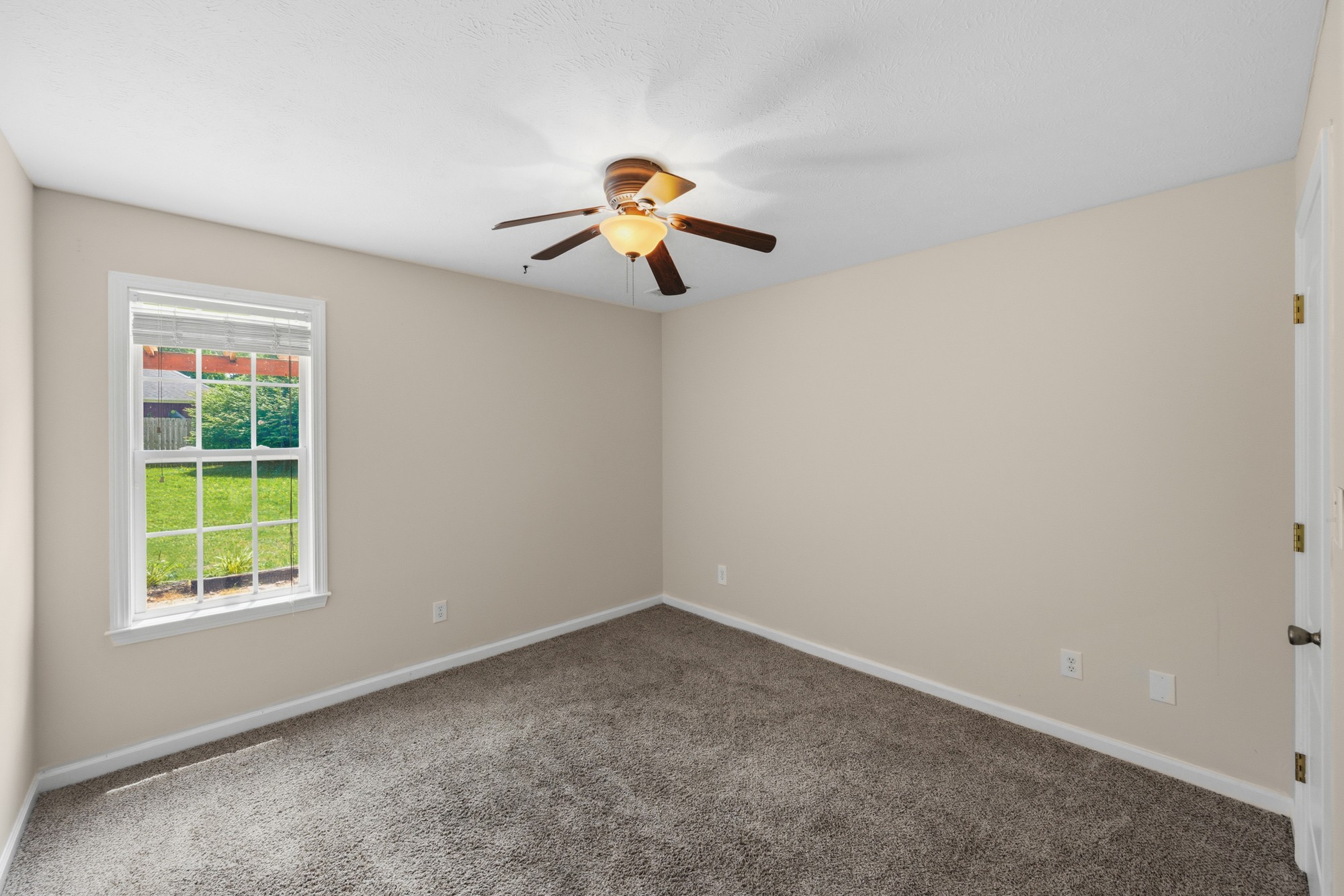 270 Reed Circle Medina, TN 38355 - Photo 22 of 30 an empty room with a window and a ceiling fan