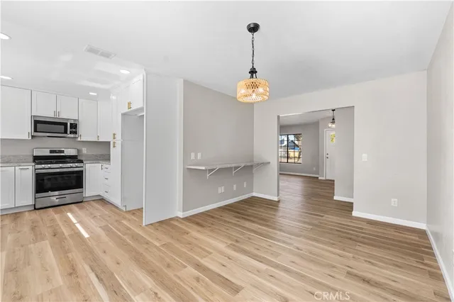 a view of a kitchen from the hallway