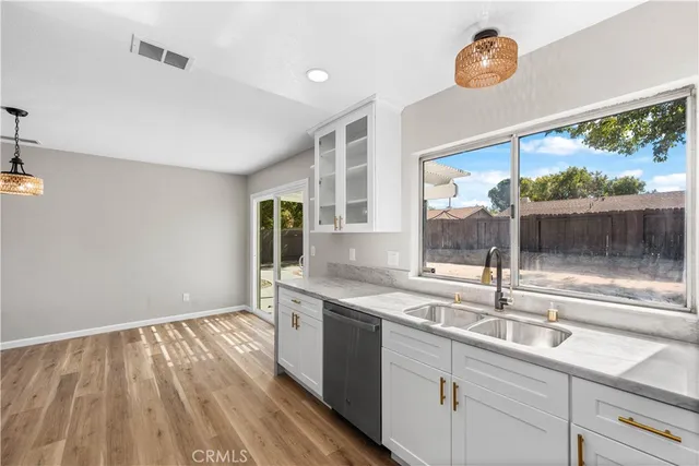 a kitchen with a sink and large window