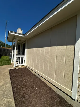 a view of backyard with small cabin