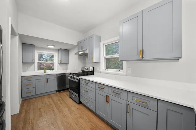 a kitchen with sink cabinets and window
