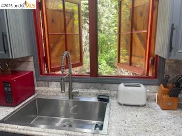 26591 Snow Bowl Road Long Barn, CA 95335 - Photo 17 of 38 a kitchen with a sink and a window