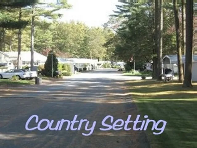 a view of a park that has a sign board