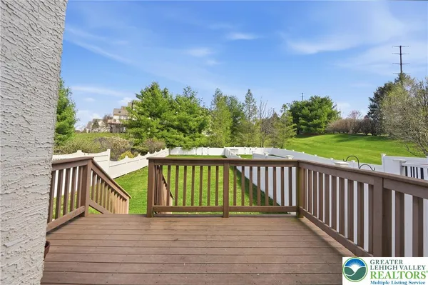 a view of a balcony with wooden floor