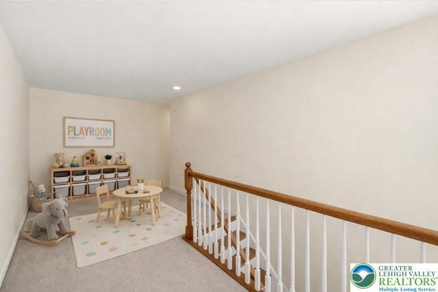 2493 Thistle Road Lower Macungie Township, PA 18062 - Photo 22 of 38 a view of a hallway with furniture and wooden floor