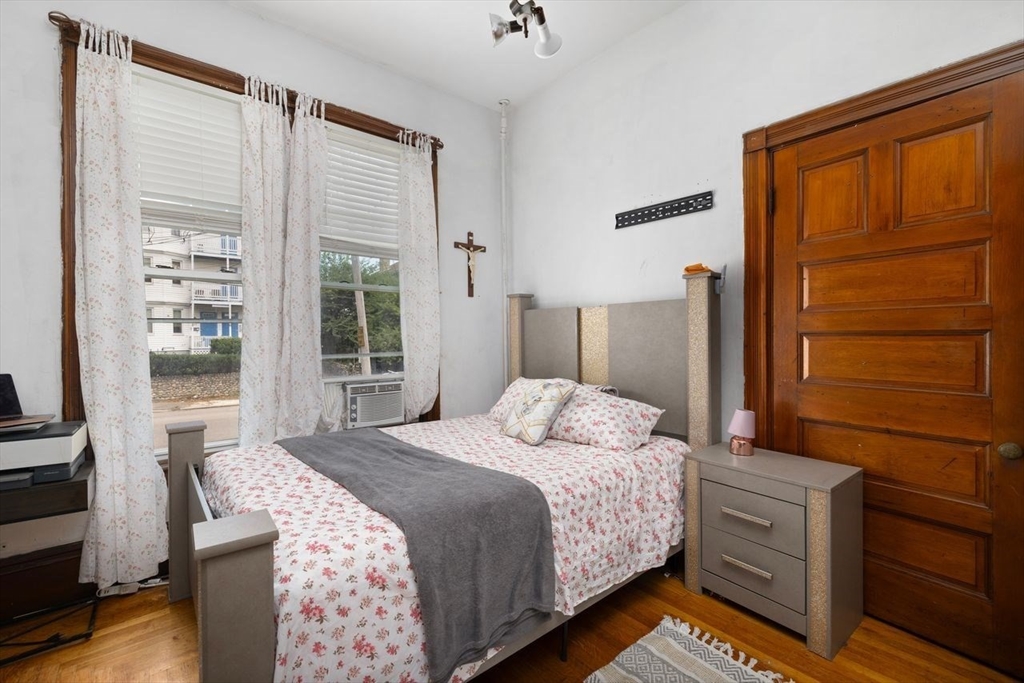 311 Elm Street Woonsocket, RI 02895 - Photo 20 of 29 a bedroom with a bed and a dresser