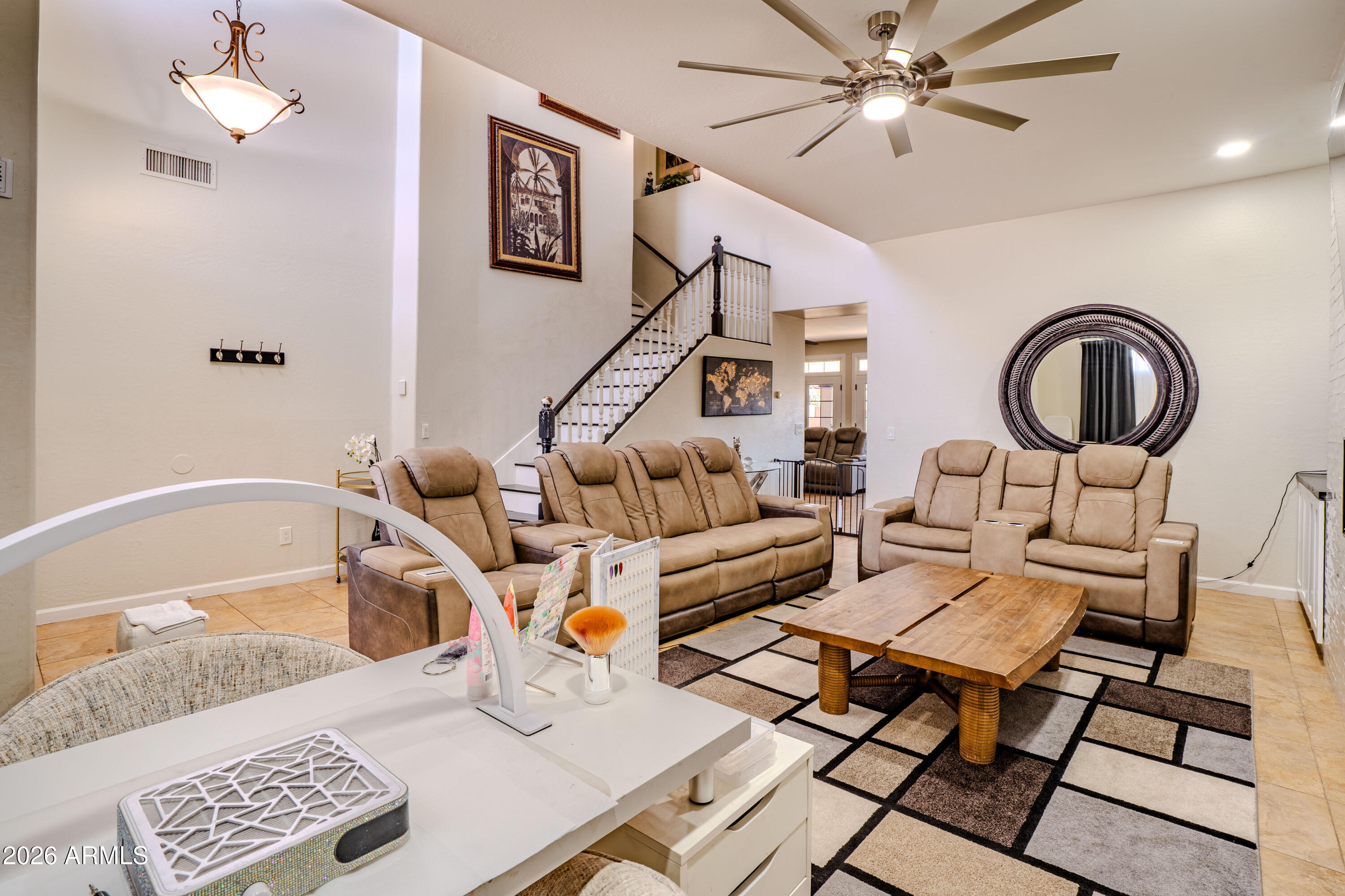 5137 West Grenadine Road Laveen, AZ 85339 - Photo 11 of 53 a living room with furniture a rug and a window