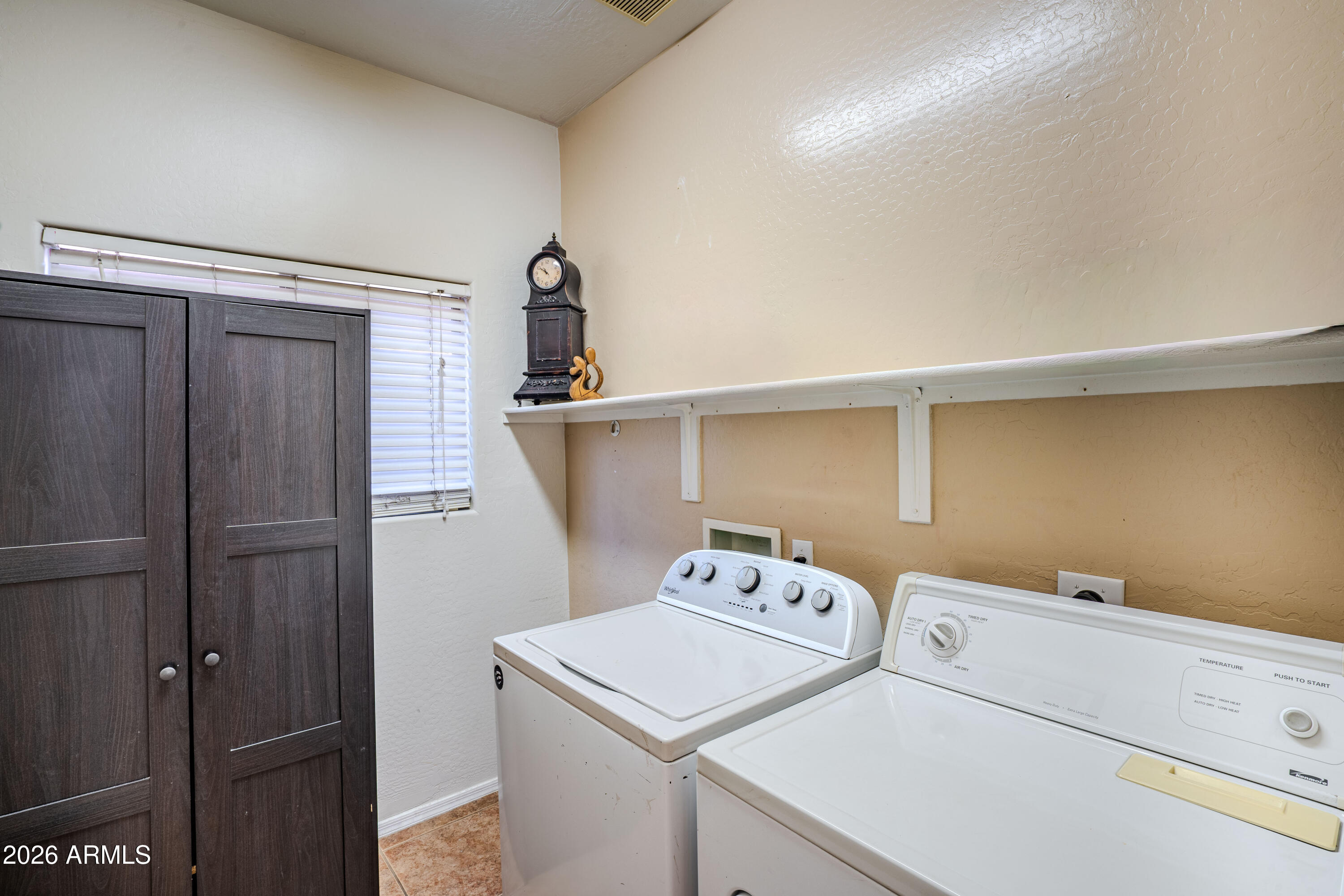 5137 West Grenadine Road Laveen, AZ 85339 - Photo 22 of 53 a utility room with dryer and washer