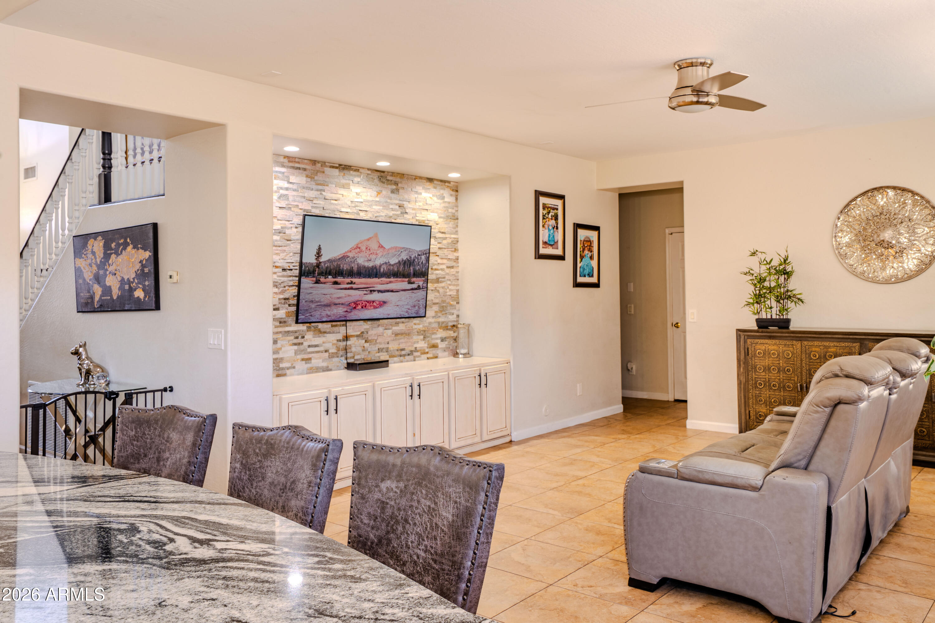 5137 West Grenadine Road Laveen, AZ 85339 - Photo 23 of 53 a living room with furniture and a flat screen tv