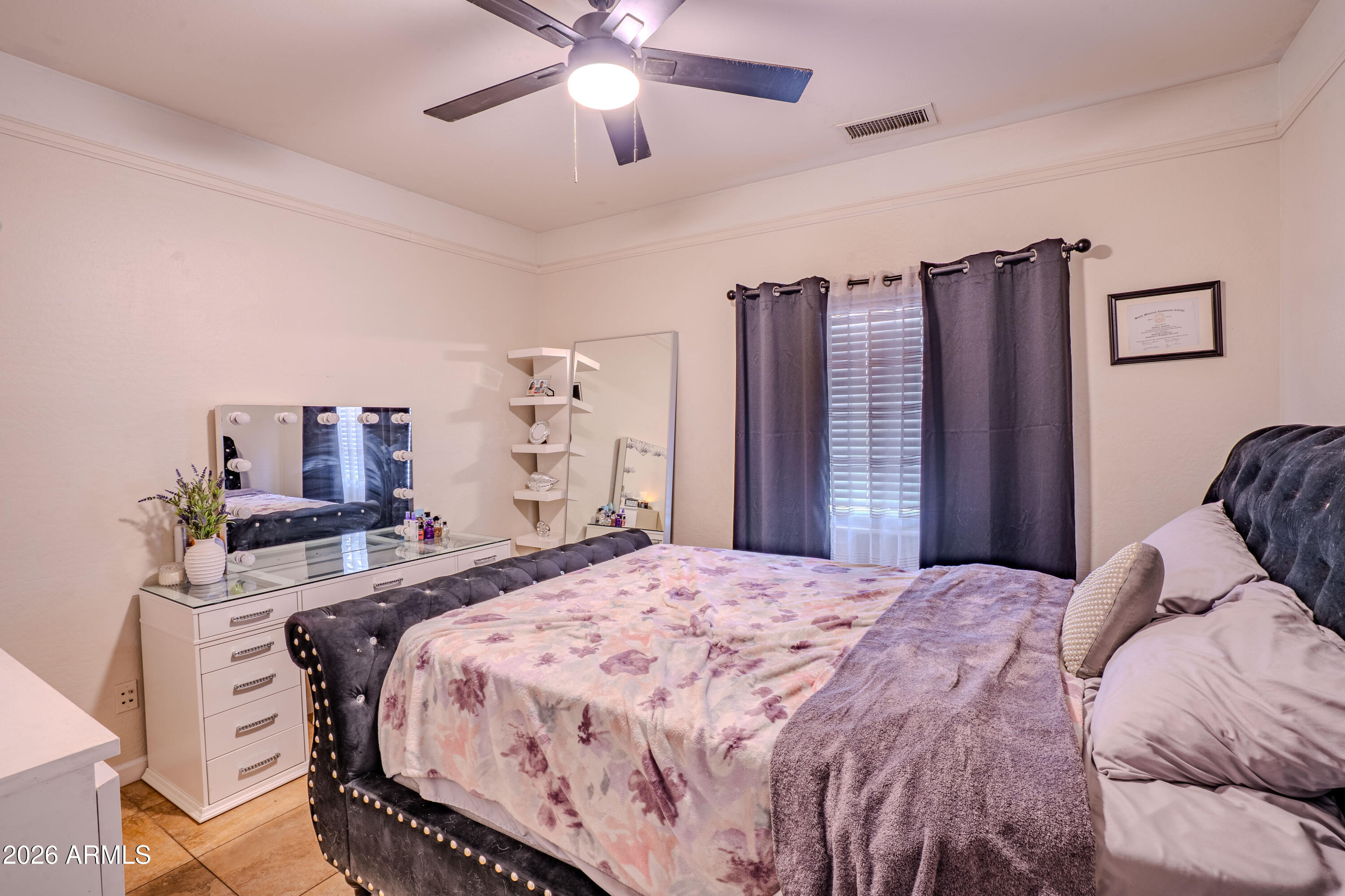 5137 West Grenadine Road Laveen, AZ 85339 - Photo 24 of 53 a bedroom with a bed and a chandelier