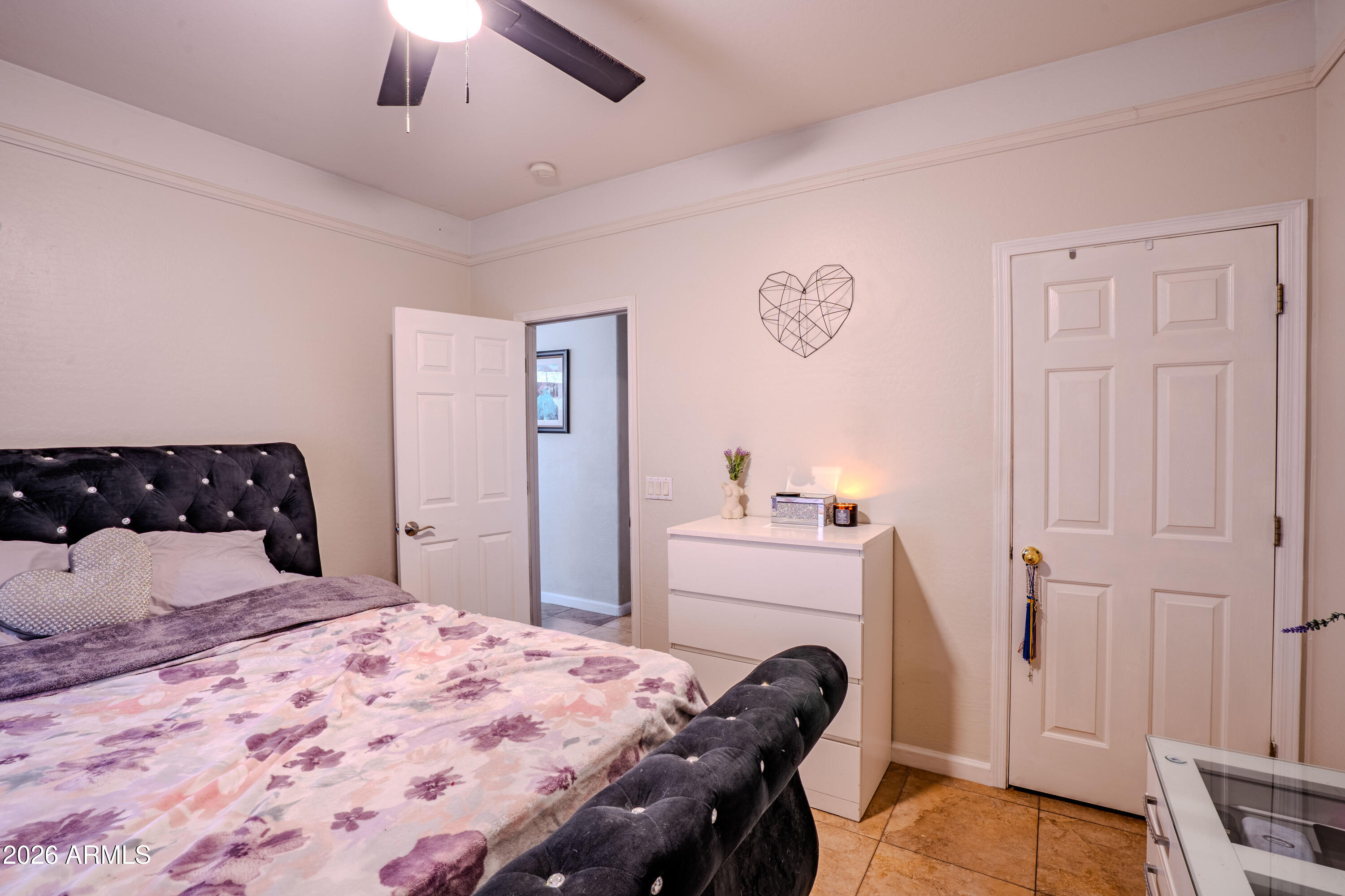 5137 West Grenadine Road Laveen, AZ 85339 - Photo 25 of 53 a bedroom with a bed and a dresser
